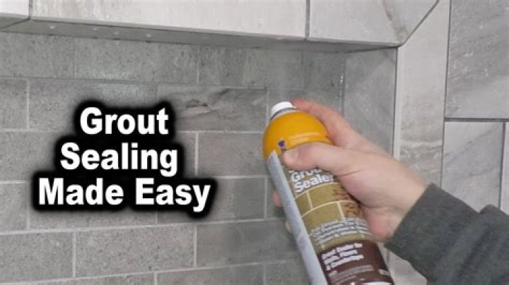 How do you clean tile before sealing grout?