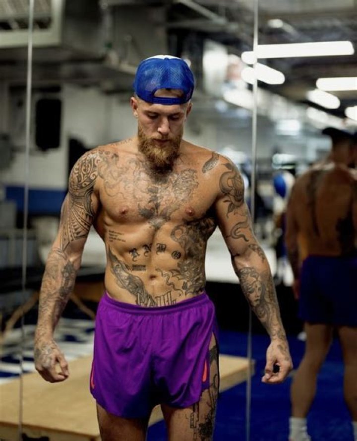 Jake Paul tattoos head, back, arm, new tattoo, rib tattoo